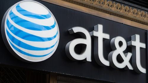 AT&T is cutting 1,800 jobs, a move that comes with contract talks about to begin in Atlanta with union leaders. (Bloomberg photo by Craig Warga)