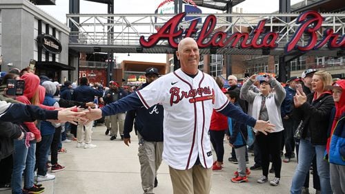 Braves manager Brian Snitker greets fans as he and players walk to Georgia Power Pavilion Stage during Braves Fest Opening Rally at The Battery Atlanta, Saturday, Jan. 21, 2023, in Atlanta. (Hyosub Shin / Hyosub.Shin@ajc.com)