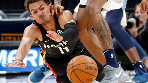 Atlanta Hawks guard Trae Young hits the floor in a battle for a loss ball against the Memphis Grizzlies Monday, July 2, 2018, in Salt Lake City.