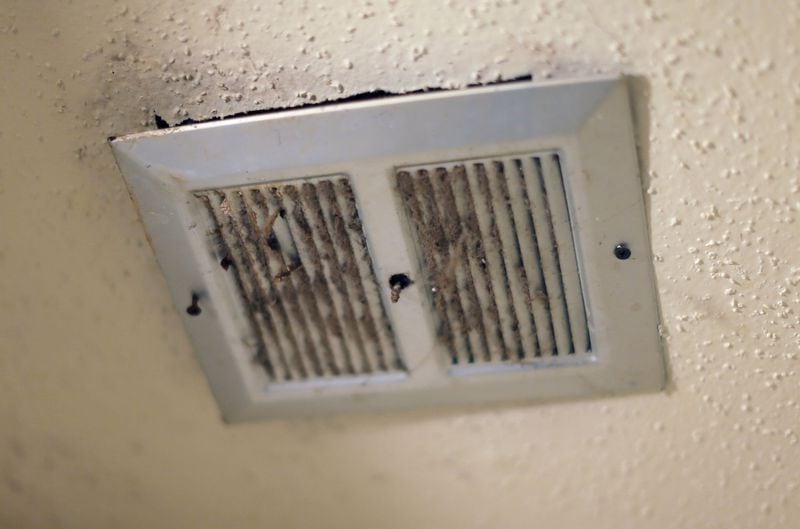 Mold grows in an air vent inside Madrika Gray’s unit at Forest Cove, near where a burst pipe in December 2017 caused a leak that has yet to be fixed. Tests at dozens of apartments there showed that their median mold spore count was double that at other locations tested by the same lab. BOB ANDRES / BANDRES@AJC.COM