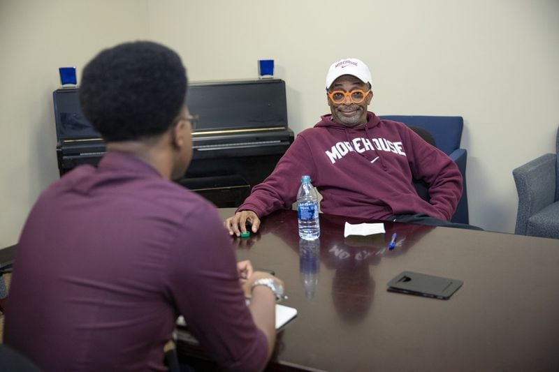A student from the Morehouse Maroon Tiger interviews Spike Lee before the start of the Human Rights Film Festival awards at Morehouse College in Atlanta on Oct. 12, 2019. CONTRIBUTED BY SEAN MCNEIL