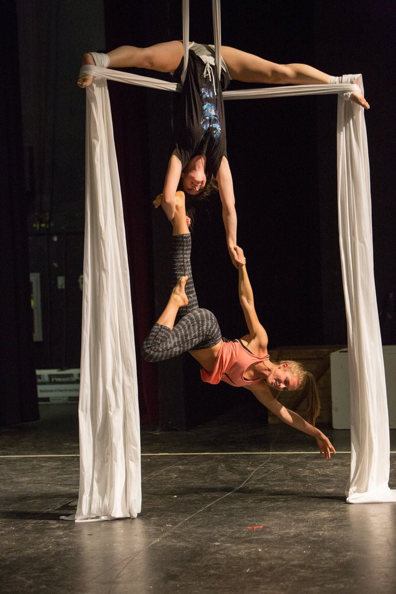 Milton High School students Abby Hepburn (top) and Faith Wagner practice on aerial silks in a unique Milton High School class inspired by Cirque du Soleil. (Photo by Phil Skinner)