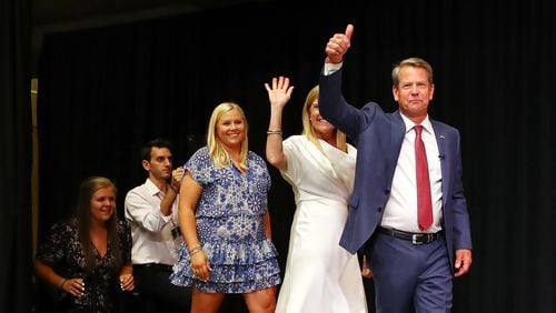 Gov. Brian Kemp gives the thumbs up as he takes the stage with his family to deliver his election night party speech at the College Football Hall of Fame on Tuesday, May 24, 2022, in Atlanta. Kemp fought off challenge in the GOP primary from former U.S. Sen. David Perdue, who entered the race at the urging of former President Donald Trump. “Curtis Compton / Curtis.Compton@ajc.com)