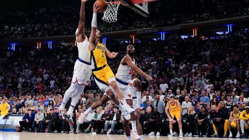 Indiana Pacers guard Andrew Nembhard (2) shoots during the first half of Game 7 in an NBA basketball second-round playoff series against the New York Knicks, Sunday, May 19, 2024, in New York. (AP Photo/Julia Nikhinson)