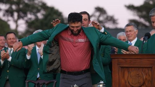 2022 Masters champion Scottie Scheffler places green jacket on 2023 champion Jon Rahm at the 2023 Masters Tournament at Augusta National Golf Club, Sunday, April 9 2023, in Augusta, Ga. (Jason Getz / Jason.Getz@ajc.com)

