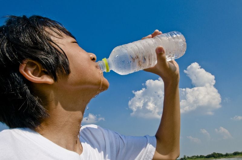 Staying hydrated throughout the day is best for teen athletes. CONTRIBUTED