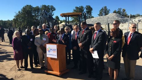 DeKalb County CEO Mike Thurmond, surrounded by mayors and government officials, speaks about the SPLOST ballot measure ahead of the vote in November 2017. MARK NIESSE / MARK.NIESSE@AJC.COM