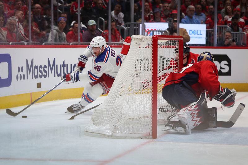 New York Rangers left wing Jimmy Vesey (26) skates with the puck during the second period in Game 4 of an NHL hockey Stanley Cup first-round playoff series against the Washington Capitals, Sunday, April 28, 2024, in Washington. (AP Photo/Tom Brenner)