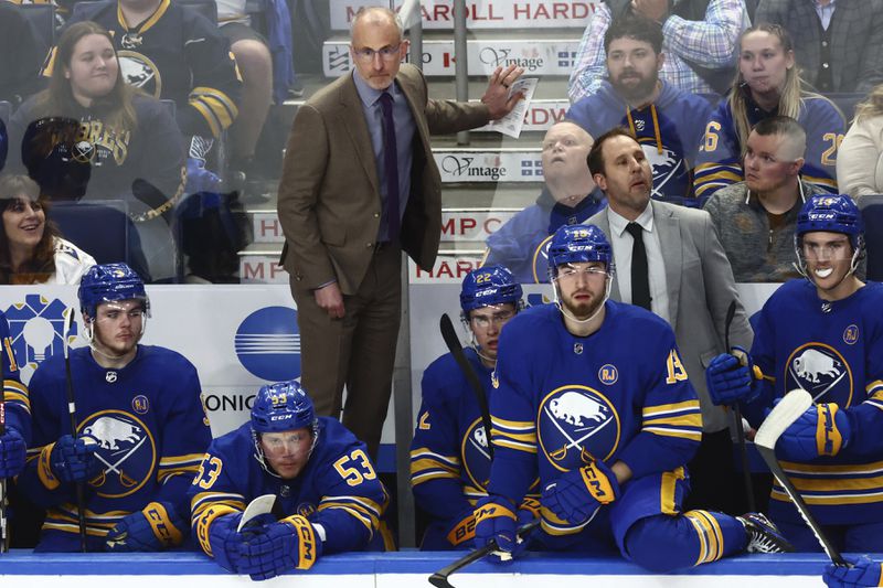 Buffalo Sabres head coach Don Granato, center top, looks on during the third period of an NHL hockey game against the Washington Capitals, Thursday, April 11, 2024, in Buffalo, N.Y. (AP Photo/Jeffrey T. Barnes)