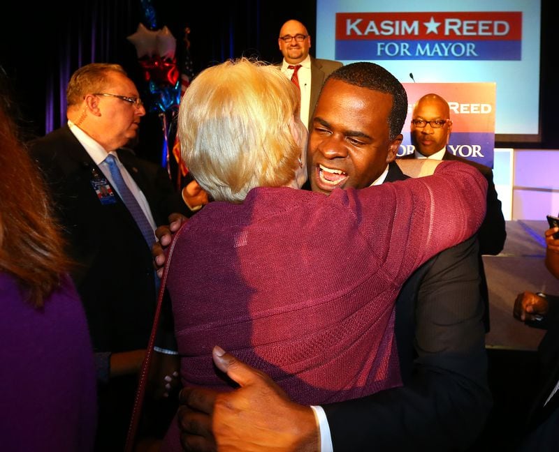 Atlanta Mayor Kasim Reed hugs a supporter following his victory speech Nov. 5, 2013.