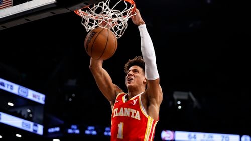 Hawks forward Jalen Johnson dunks against the Brooklyn Nets during the second half of an NBA basketball game, Saturday, March 2, 2024, in New York. (AP Photo/Noah K. Murray)