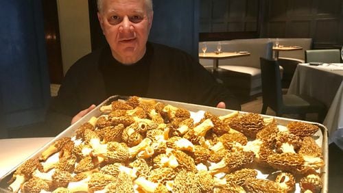 Aria chef-owner Gerry Klaskala with a tray of newly arrived golden morels. Klaskala, who calls himself “weirdly visual,” planned to feature the mushrooms in a simple preparation with minimal ingredients. Culling from his mental inventory of flavors, tastes and textures, Klaskala said that “my mind starts to imagine those ingredients.” Photo by Ligaya Figueras/lfigueras@ajc.com