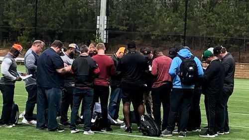 Here are NFL scouts exchanging information on the official times from the Kennesaw State Pro Day drills at The Perch on Wednesday, April 11, 2020. (By D. Orlando Ledbetter/dledbetter@ajc.com)