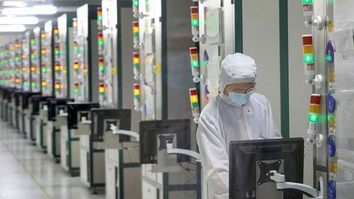 An employee works at a factory of Jiejie Semiconductor Company in Nantong, in eastern China's Jiangsu province, on March 17, 2021. (AFP/Getty Images/TNS)