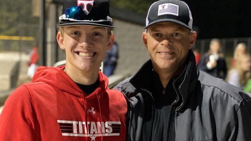 Georgia baseball coach Scott Stricklin (R) makes it to every North Oconee High game he possibly can so he can watch his son Cale play. (Family photo)
