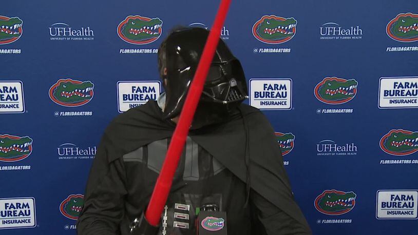 Florida football coach Dan Mullen addresses the media dressed as Darth Vader Saturday, Oct. 31, 2020, in Gainesville, Fla.