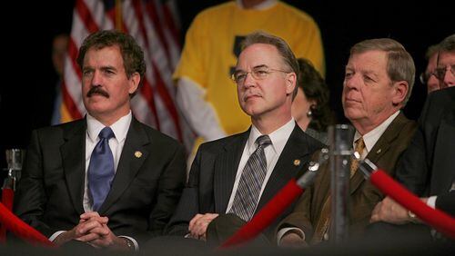 Georgia U.S. Rep. Tom Price, center, and U.S. Sen. Johnny Isakson, right, listen to then-Vice President Dick Cheney during a visit to Smyrna in 2005. (JOHN SPINK/AJC staff)