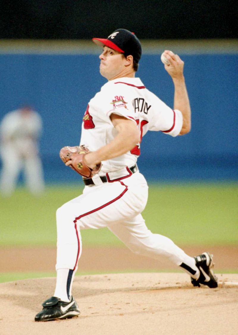 Greg Maddux pitches against the Rockies in the 1995 postseason. (AJC file photo)