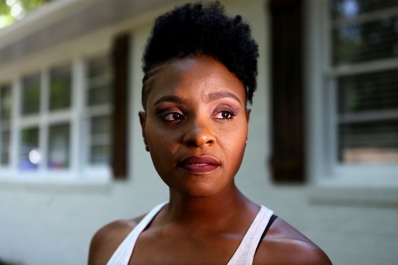 Tamika English, who had an abortion when she was in high school, poses for a portrait outside her home in east Cobb. She has no doubts she made the right decision. Curtis Compton / Curtis.Compton@ajc.com