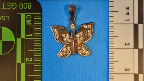 This butterfly charm was found with the remains of a woman's bones in Banks County in February. (Credit: GBI)
