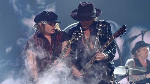 Actor/musician Johnny Depp (L) and musician Joe Perry of Hollywood Vampires perform onstage during The 58th GRAMMY Awards at Staples Center on February 15, 2016 in Los Angeles, California. (Photo by Larry Busacca/Getty Images for NARAS)