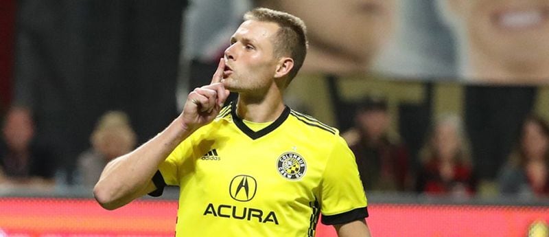 Columbus' Adam Jahn makes a "sssshhhh-ing" motion toward Atlanta United's supporters following the team's playoff victory in 2017.  (Jason Getz / USA Today)