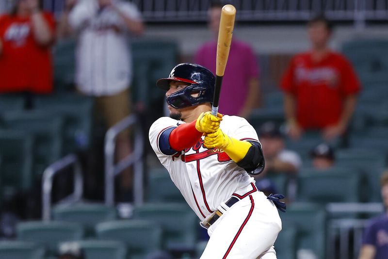 Atlanta Braves William Contreras singles to bring in the winning run in the ninth inning of a baseball game against the Philadelphia Phillies, Tuesday, May 24, 2022, in Atlanta. (AP Photo/Todd Kirkland)