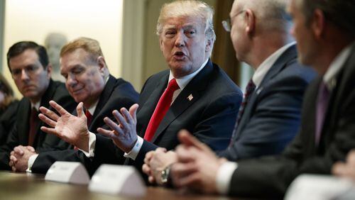 President Donald Trump speaks during a meeting with steel and aluminum executives in the Cabinet Room of the White House, Thursday. (AP Photo / Evan Vucci)