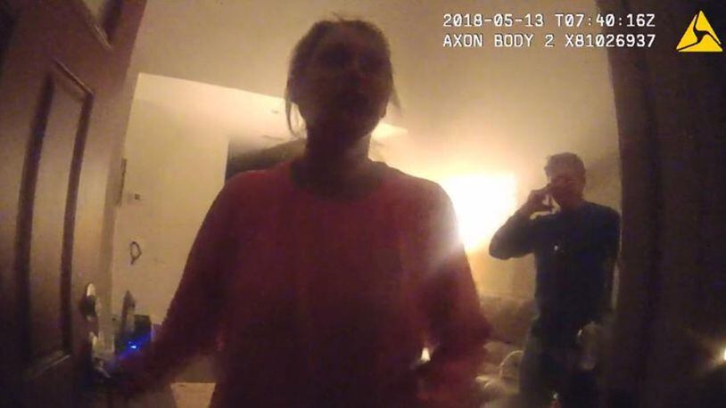 Katie Kettles Sasser at her front door the night of May 13 as officers answer a domestic incident involving her estranged husband Lt. Robert C. Sasser. This photo is from police body cam footage. The man in the background is John Hall Jr. Both Kettles Sasser and Hall were fatally shot by Lt. Sasser on June 28 at Hall’s home. Sasser then killed himself with a gunshot in a SWAT incident at his home.