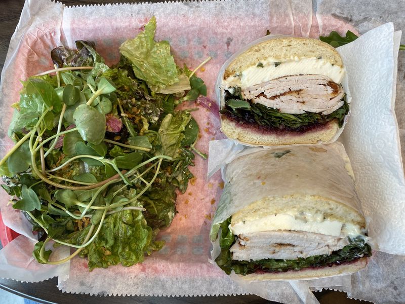 For a taste of Thanksgiving, try the Turkey Stack, with cranberry relish among the fillings. All sandwiches come with house-made chips or a salad. Ligaya Figueras/ligaya.figueras@ajc.com
