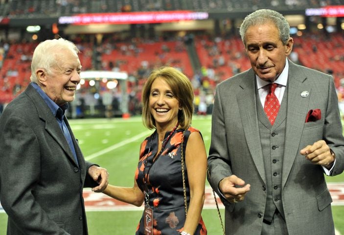 Who is Angie Macuga, wife of Atlanta Falcons owner Arthur Blank?