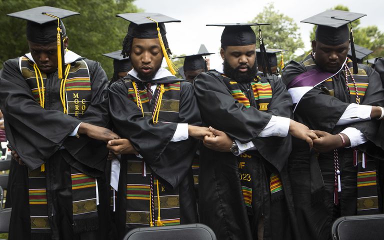 Members of the Morehouse Class of 2023 sing their college anthem during the Morehouse College commencement ceremony on Sunday, May 21, 2023, on Century Campus in Atlanta. The graduation marked Morehouse College's 139th commencement program. CHRISTINA MATACOTTA FOR THE ATLANTA JOURNAL-CONSTITUTION