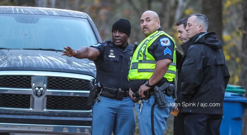 Cobb County officers respond to a shooting on Buckland Way in Mableton on Monday morning. JOHN SPINK / JSPINK@AJC.COM