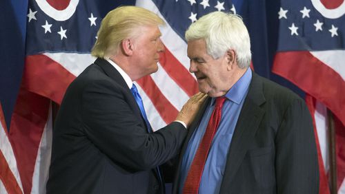 Donald Trump and former House Speaker Newt Gingrich share the stage during a campaign rally in Cincinnati. (AP Photo/John Minchillo)