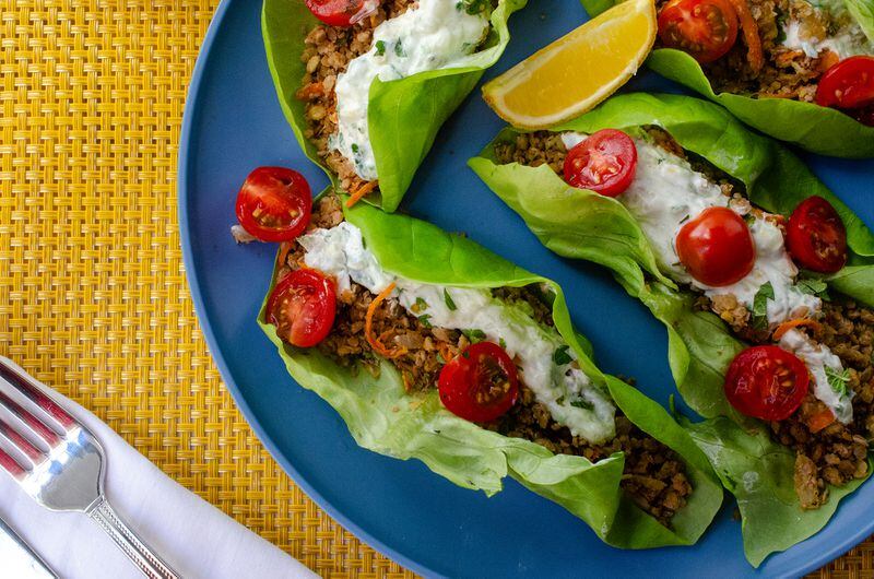 Boost your brain power with these Mediterranean Lentil Walnut Lettuce Cups, shown topped with creamy tzatziki. (Virginia Willis for The Atlanta Journal-Constitution)