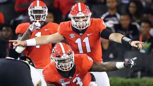 October 14, 2017 Athens: Georgia quarterback Jake Fromm and center Lamont Gaillard call the offensive adjustments againt Missouri during the first half in a NCAA college football game on Saturday, October 14, 2017, in Athens.   Curtis Compton/ccompton@ajc.com