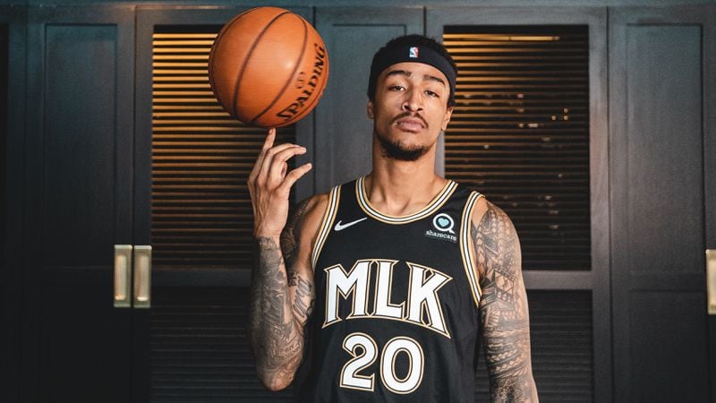 Hawks forward John Collins models Atlanta's 2020-21 City Edition uniform, which honors the Rev. Martin Luther King Jr.
