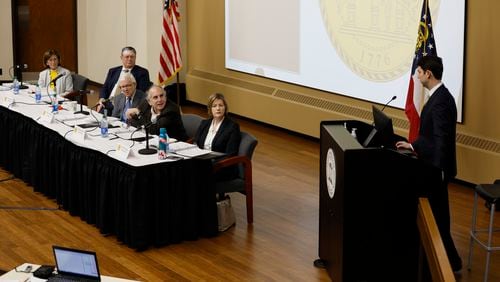 Georgia State Election Board members listen to Ryan Germany, general counsel for Republican Secretary of State, during the board meeting at Mercer University in Macon on Tuesday, Feb 7, 2023. The board dismissed a case brought by anonymous person called "Totes Legit Votes" who alleged ineligible voters on Aug. 1, 2023. Miguel Martinez / miguel.martinezjimenez@ajc.com