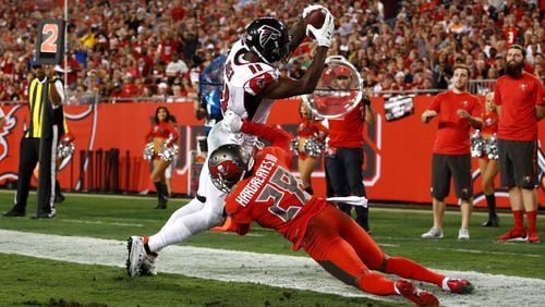 Falcons wide receiver Julio Jones keeps his feet in the end zone in front of cornerback Vernon Hargreaves as he hauls in a 3-yard touchdown pass from quarterback Matt Ryan during the third quarter Nov. 3, 2016, at Raymond James Stadium in Tampa.