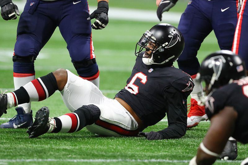 Falcons outside linebacker Dante Fowler is knocked to the turf by Patriots offensive lineman Ted Karras on another unsuccessful pass rush attempt during the second half in a NFL football game on Thursday, Nov. 18, 2021, in Atlanta.    “Curtis Compton / Curtis.Compton@ajc.com”