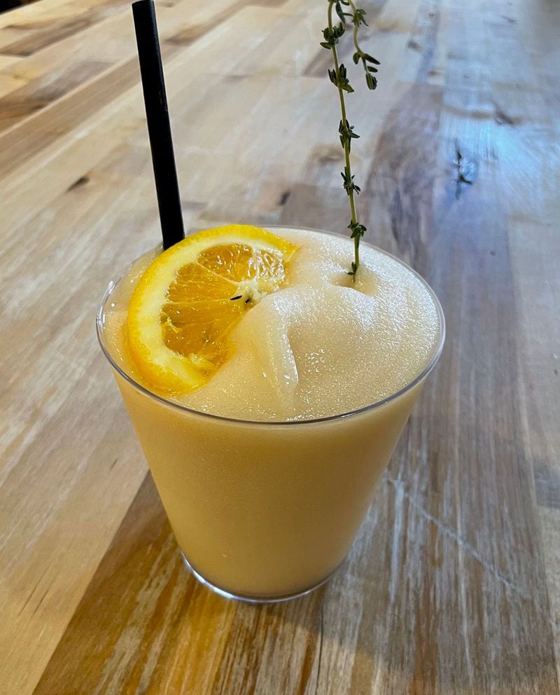 The Frozen in Thyme from Patty & Frank's features a frozen swirl of bourbon, peach, citrus and fresh thyme. Angela Hansberger for The Atlanta Journal-Constitution