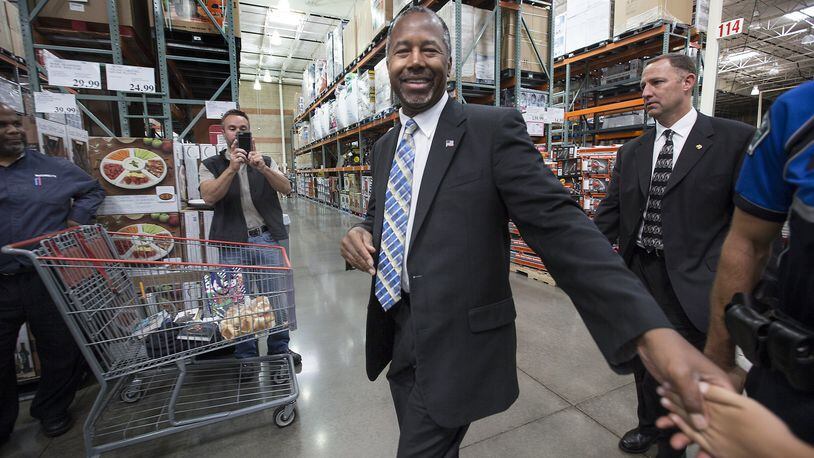 Ben Carson greets supporters at the Costco in Northwest Austin, where he stopped on a book tour.