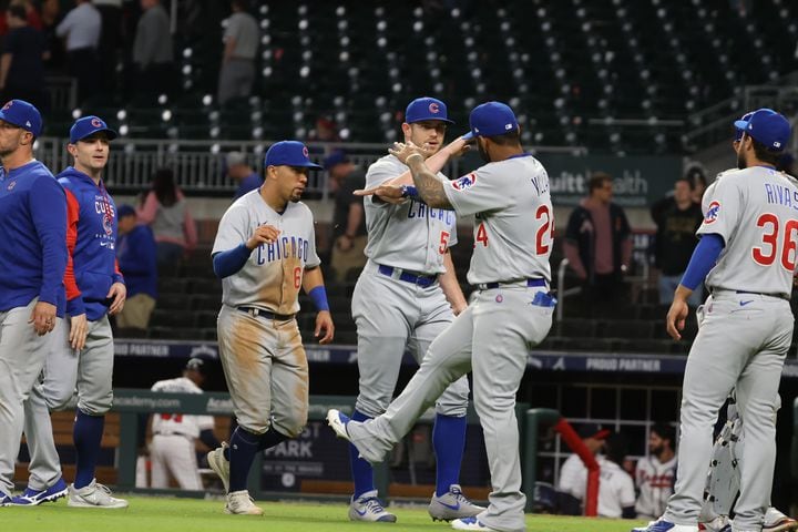Chicago Cubs celebrates a victory against Atlanta Braves in extra innings 6-3 at Truist Park on Wednesday, April 27, 2022.  Miguel Martinez / miguel.martinezjimenez@ajc.com