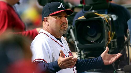 Atlanta Braves manager Fredi Gonzalez (33) argues from the dugout during a baseball game Toronto Blue Jays Wednesday, Sept. 16, 2015, in Atlanta. (AP Photo/John Bazemore)