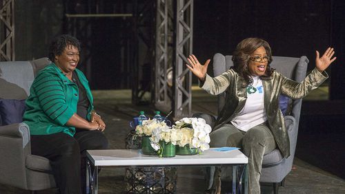11/01/2018 -- Marietta, Georgia -- Oprah Winfrey[cq] (Right) and Georgia gubernatorial candidate Stacey Abrams speak to a crowd gathered for a town hall conversation at the Cobb Civic Center's Jennie T. Anderson Theatre in Marietta, Thursday, November 1, 2018. Winfrey visited Georgia on Thursday to canvass neighborhoods in Metro Atlanta and show her support for gubernatorial candidate Stacey Abrams. (ALYSSA POINTER/ALYSSA.POINTER@AJC.COM)