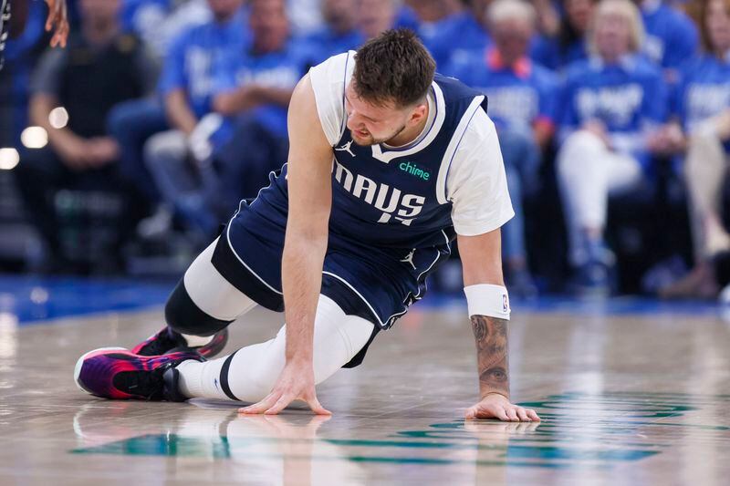 Dallas Mavericks guard Luka Doncic is slow to get up after a play against the Oklahoma City Thunder during the first half of Game 1 of an NBA basketball second-round playoff series, Tuesday, May 7, 2024, in Oklahoma City. (AP Photo/Nate Billings)