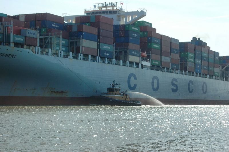 Savannah, Ga.: A pilot craft on the Savannah River guides the Cosco Development, which at the time of its visit in May 2017, was the largest container ship to ever call on an East Coast port. Thursday, May 11, 2017. J. Scott Trubey/strubey@ajc.com