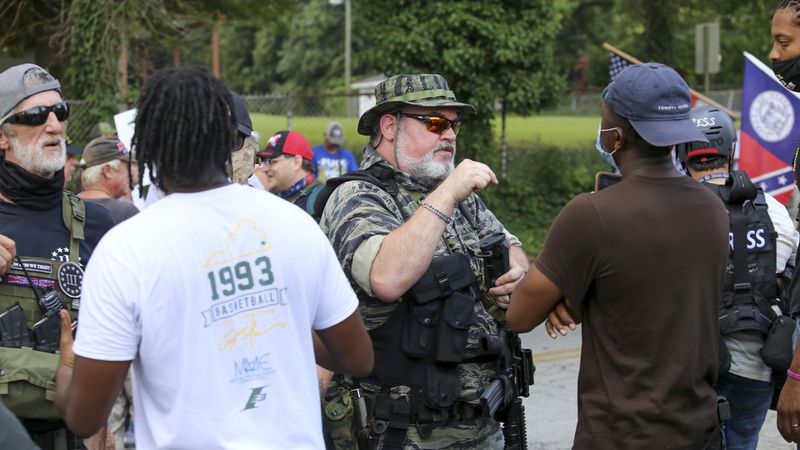8/15/20 - Stone Mountain, GA - Protestors and counter protestors face off  as several far-right groups, including militias and white supremacists, rally Saturday in the town of Stone Mountain, and a broad coalition of leftist anti-racist groups organized a counter-demonstration there after local authorities closed Stone Mountain park.   Jenni Girtman for the Atlanta Journal Constitution