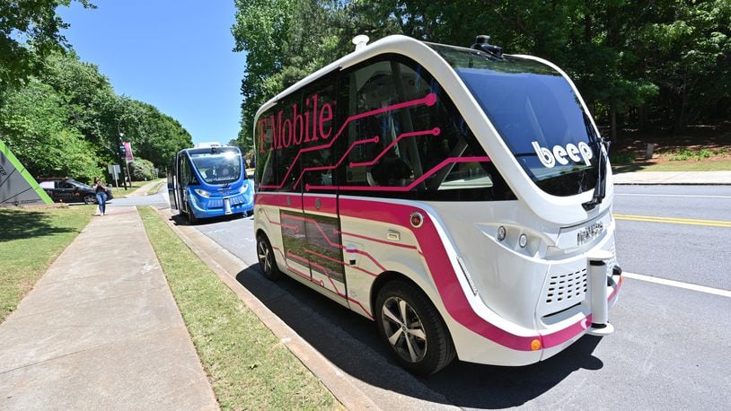 May 12, 2022 Peachtree Corners - Guests get a test ride of an autonomous shuttles in Peachtree Corners on Thursday, May 12, 2022. On Thursday May 12, top automakers, technology companies and carriers are coming together at the Curiosity Lab in Peachtree Corners and Applied Information in Alpharetta for live demos as part of the 5G Automotive Association (5GAA) conference. (Hyosub Shin / Hyosub.Shin@ajc.com)