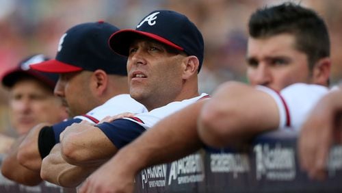 Tim Hudson is in the dugout to watch during the first inning against the Mets in their MLB baseball game on Tuesday, Sept. 3, 2013, in Atlanta. CURTIS COMPTON / CCOMPTON@AJC.COM